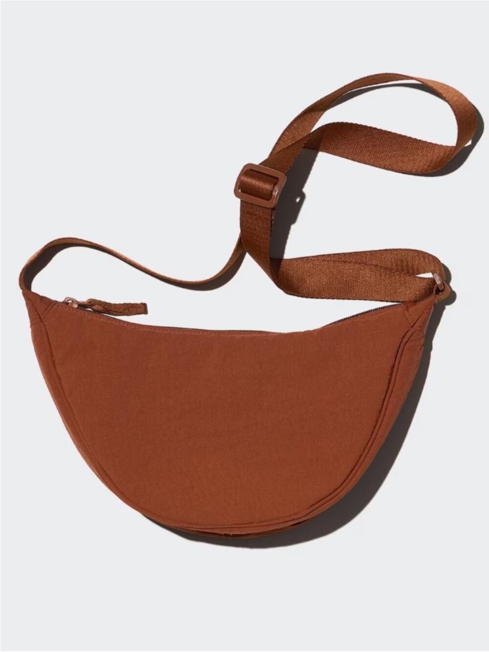 Uniqlo round mini Crescent Crossbody shoulder Bag in Brown